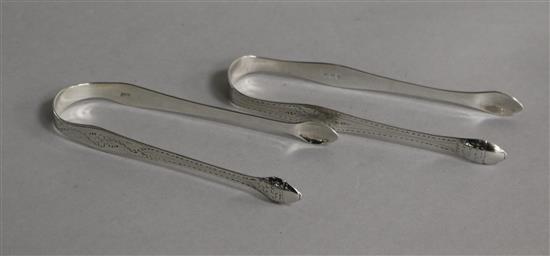 A pair of George III Hester Bateman silver sugar tongs and a pair of silver tongs by Peter and Ann Bateman